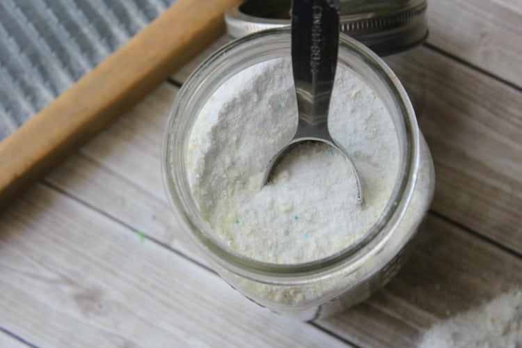homemade laundry detergent in a mason jar with a measuring spoon on top